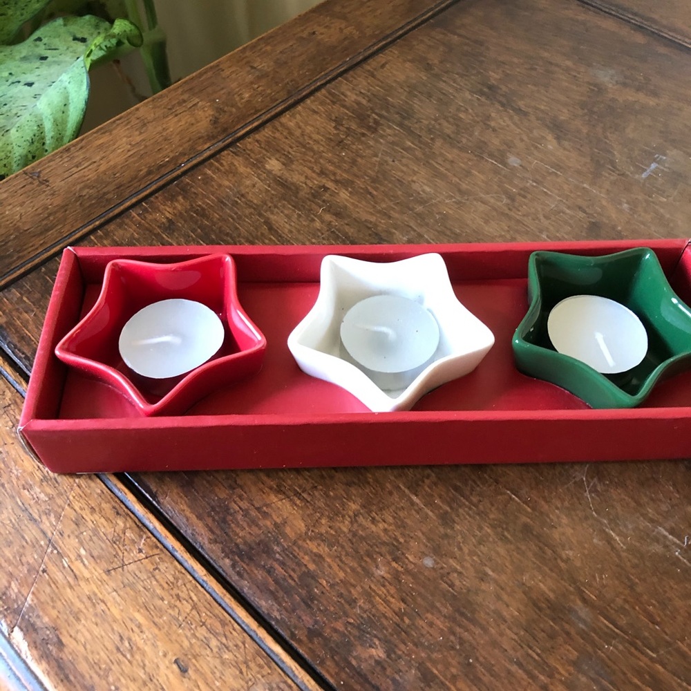 Set of 3 star shape ceramic votive holders.